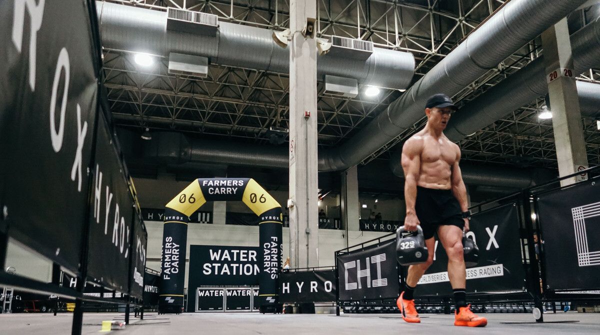 Luke Britton on the farmers carry at HYROX Chicago